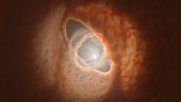 En la ilustración, los tres anillos de polvo y fas, desalineados, rodean el sistema estelar triple GW Orionis