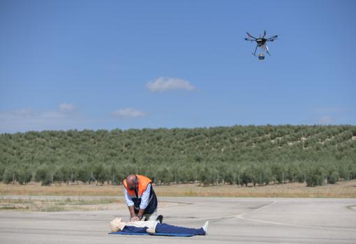 A drone transports a defibrillator in a simulated heart attack