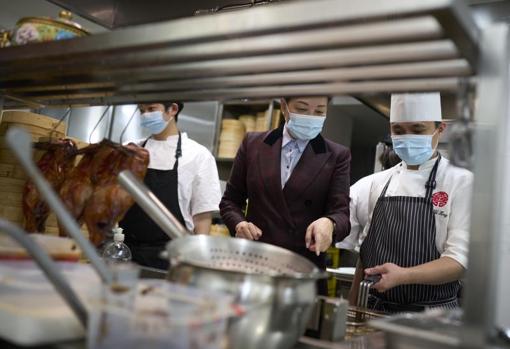 Maria Li Bao in the kitchens of Royal Crown, the restaurant that gives her restaurant group its name