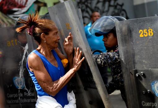 A woman confronts the Police during a protest in Caracas in 2017